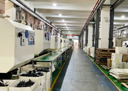 Plastic injection molding production workshop with rows of molding machines