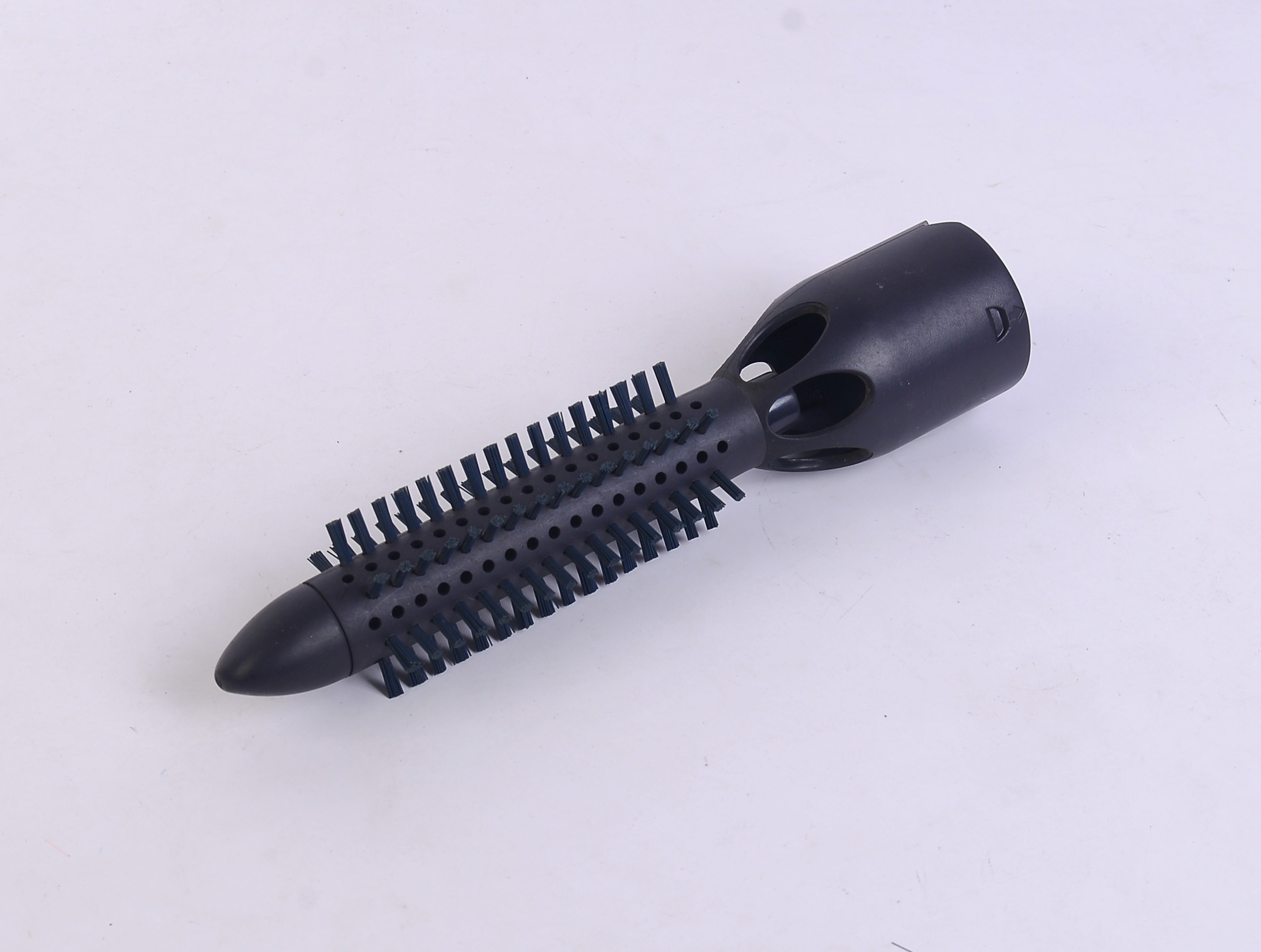 Custom molded brush component with a completed filament pattern.