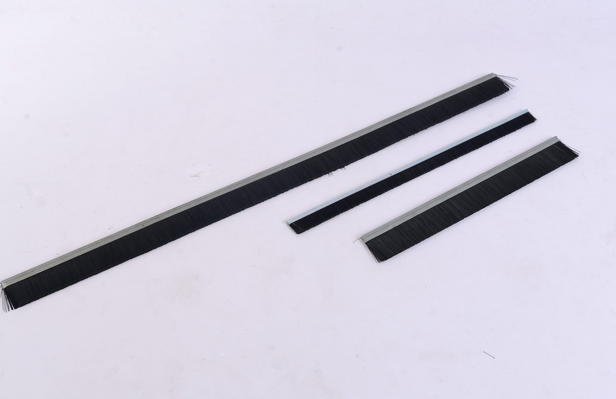 Molded brush product with a project-specific flocking pattern.